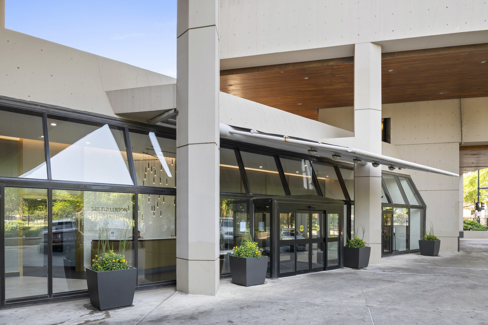 345 West Fullerton Parkway, Unit 1706 Chicago, IL 60614 - Photo 2 of 26 a front view of a building with glass windows door