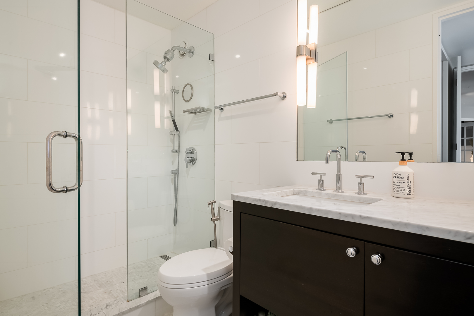 345 West Fullerton Parkway, Unit 1706 Chicago, IL 60614 - Photo 22 of 26 a bathroom with a granite countertop sink a toilet and shower