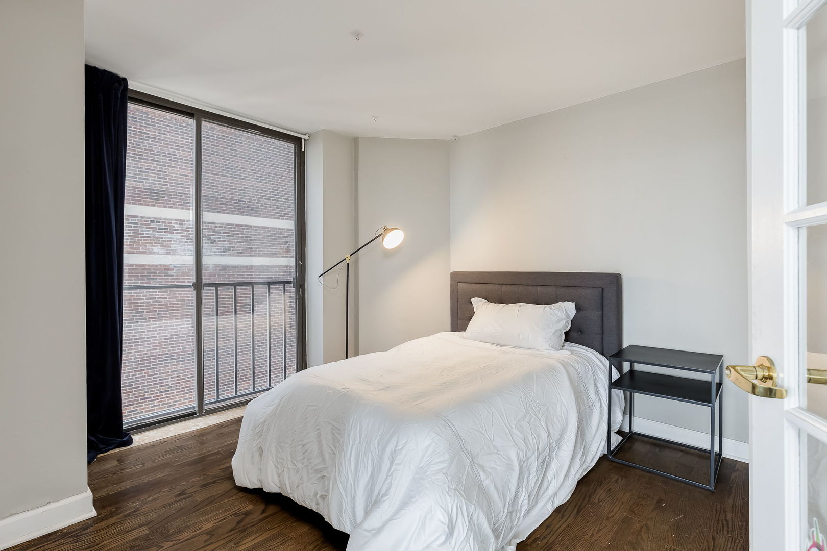 345 West Fullerton Parkway, Unit 1706 Chicago, IL 60614 - Photo 23 of 26 a large bed sitting in a bedroom next to a window