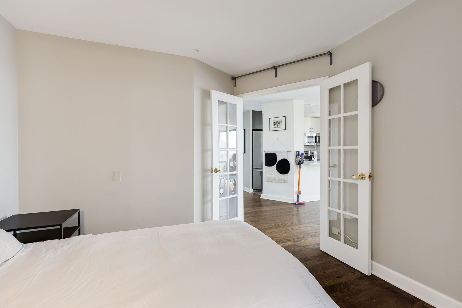 345 West Fullerton Parkway, Unit 1706 Chicago, IL 60614 - Photo 24 of 26 a bedroom with a bed and wooden floor