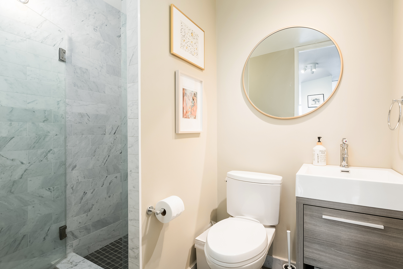 345 West Fullerton Parkway, Unit 1706 Chicago, IL 60614 - Photo 25 of 26 a white toilet sitting next to a bathroom sink