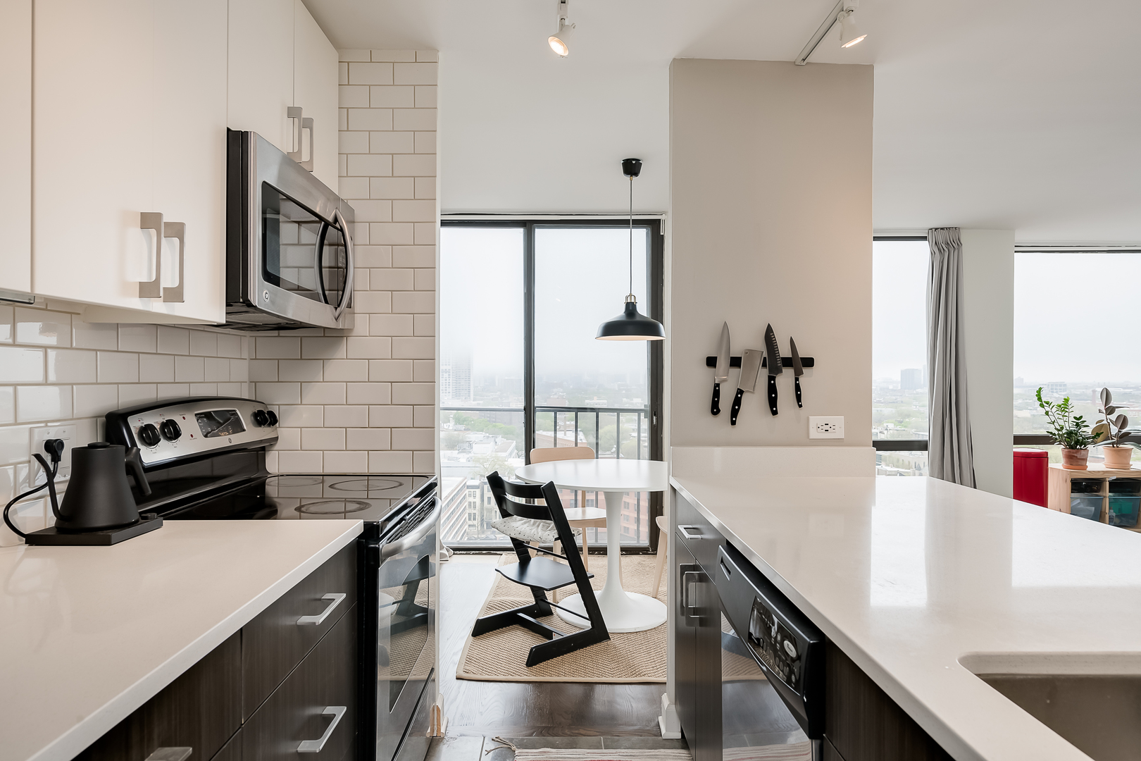 345 West Fullerton Parkway, Unit 1706 Chicago, IL 60614 - Photo 5 of 26 a kitchen with a sink a stove and cabinets