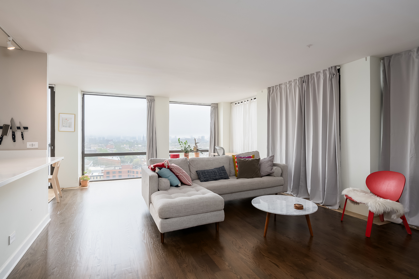 345 West Fullerton Parkway, Unit 1706 Chicago, IL 60614 - Photo 6 of 26 a living room with furniture and a large window