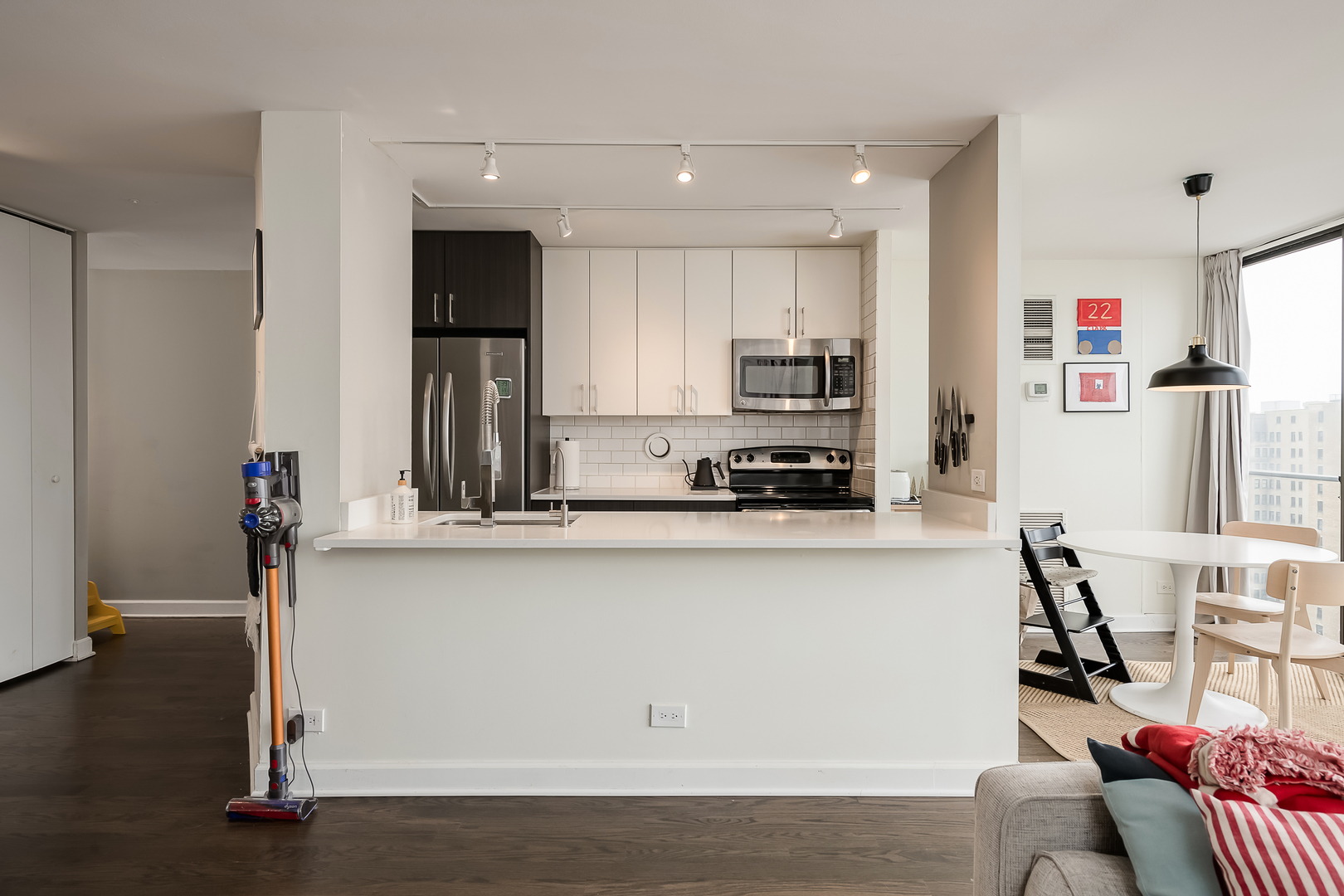 345 West Fullerton Parkway, Unit 1706 Chicago, IL 60614 - Photo 9 of 26 a kitchen with stainless steel appliances granite countertop a refrigerator sink and cabinets