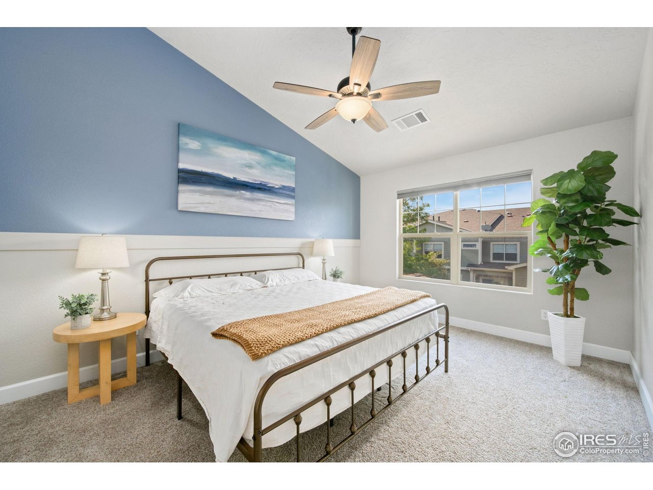 5775 29th Street, Unit 1307 Greeley, CO 80634 - Photo 11 of 28 Primary bedroom with vaulted ceilings and abundant light.