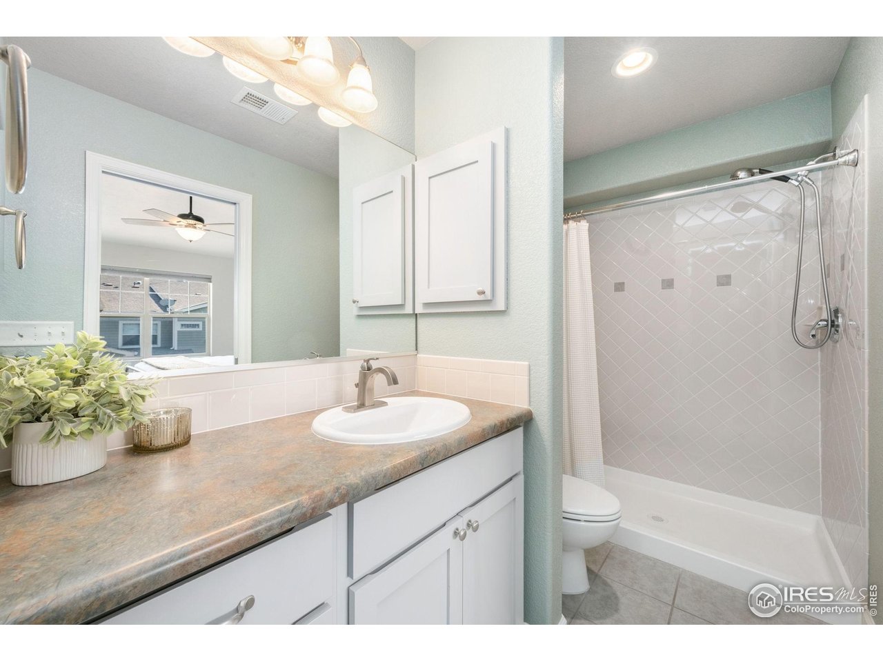 5775 29th Street, Unit 1307 Greeley, CO 80634 - Photo 13 of 28 Private en-suite bathroom in the primary suite.