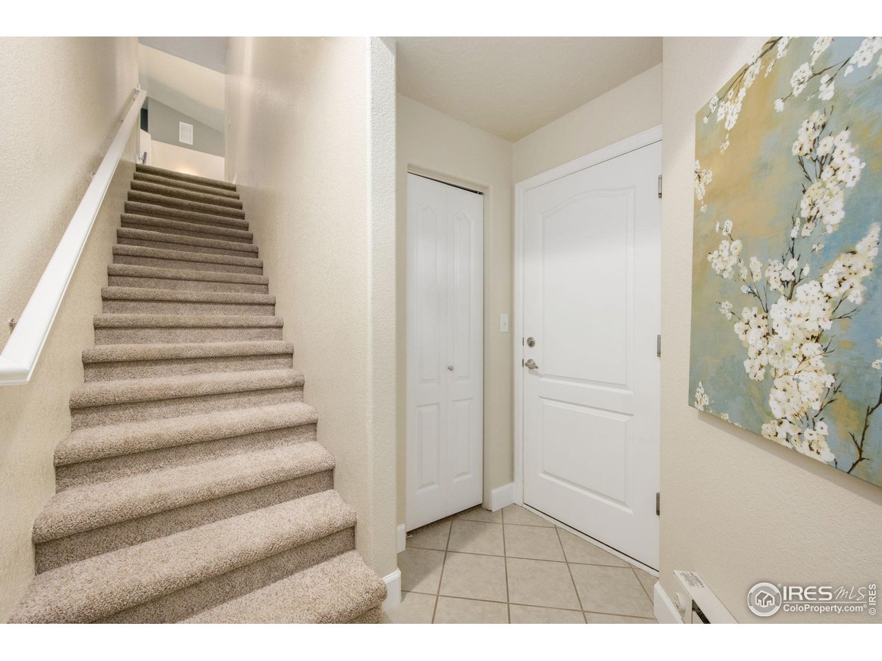 5775 29th Street, Unit 1307 Greeley, CO 80634 - Photo 17 of 28 Entry with garage access, coat closet and stairs to upper unit.