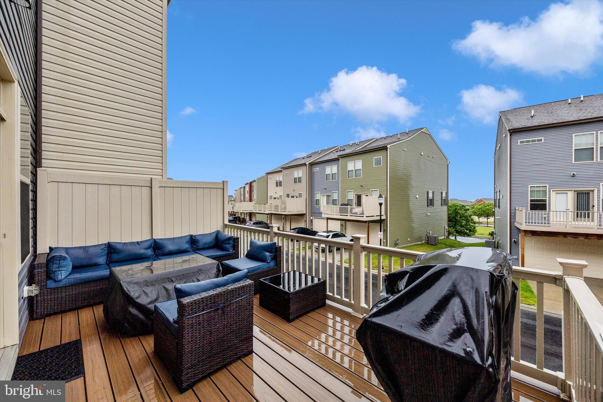 1817 Bird Run Frederick, MD 21702 - Photo 24 of 31 a balcony view with couches and wooden floor