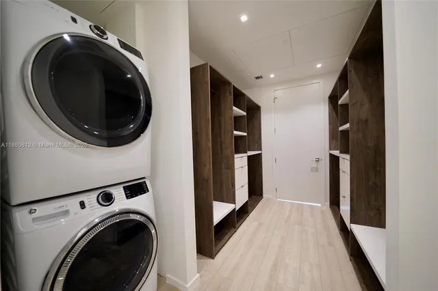 a view of a hallway with washer and dryer