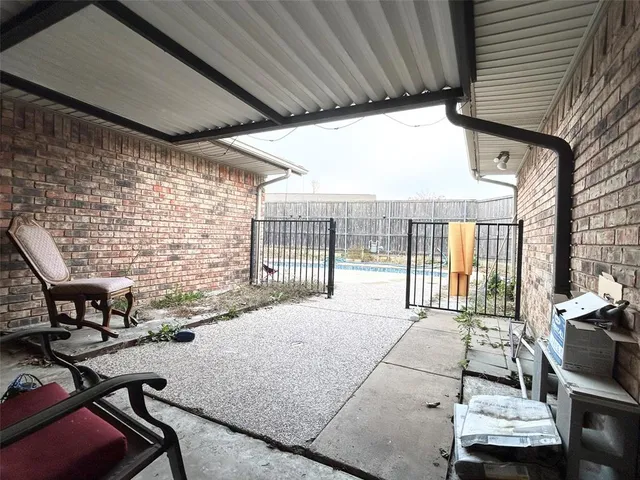 a view of balcony with furniture