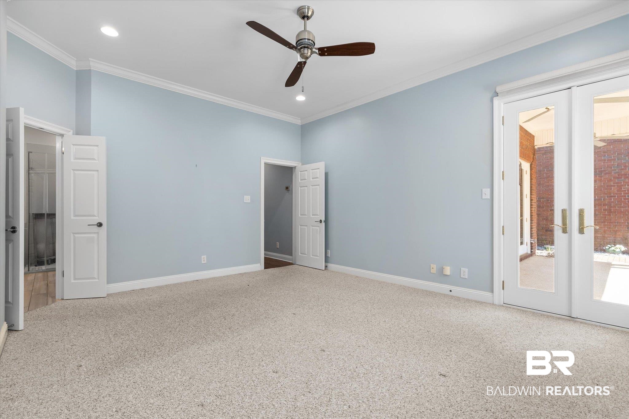 107 Fielding Place Mobile, AL 36608 - Photo 9 of 27 Unfurnished bedroom featuring access to exterior, carpet flooring, baseboards, crown molding, and recessed lighting