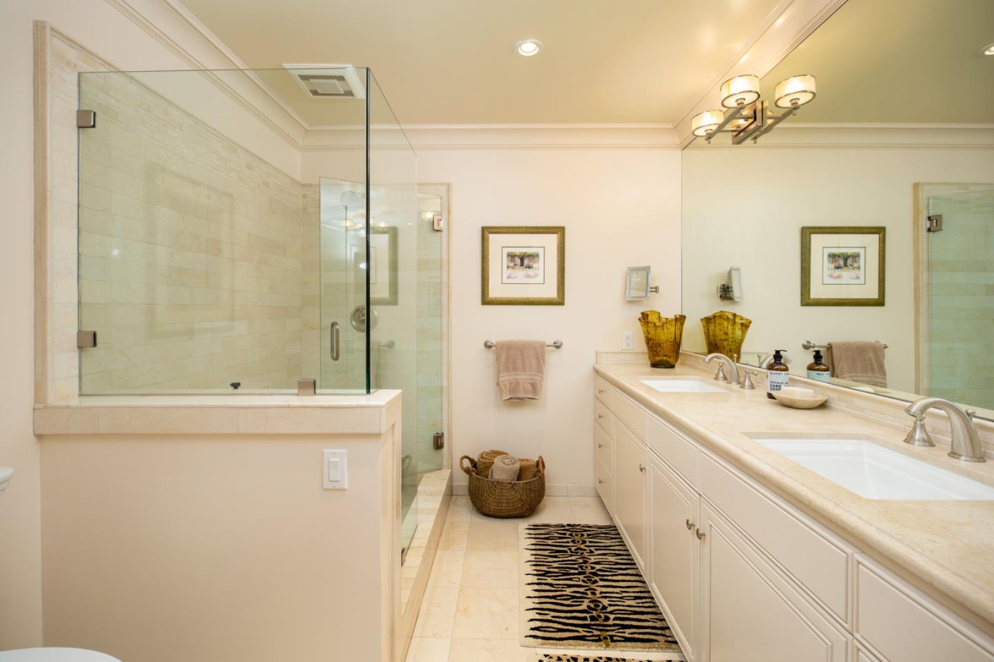 1534 Riata Road Pebble Beach, CA 93953 - Photo 16 of 50 a bathroom with a granite countertop sink a toilet a shower and a mirror