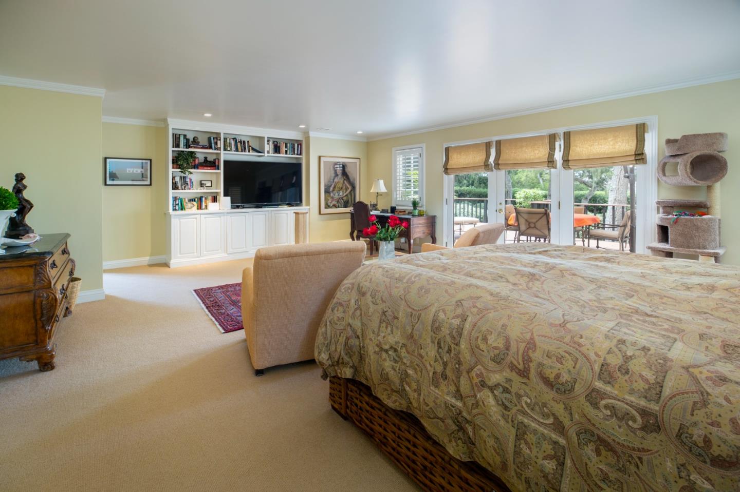 1534 Riata Road Pebble Beach, CA 93953 - Photo 21 of 50 a bed room with a bed window and a flat screen tv
