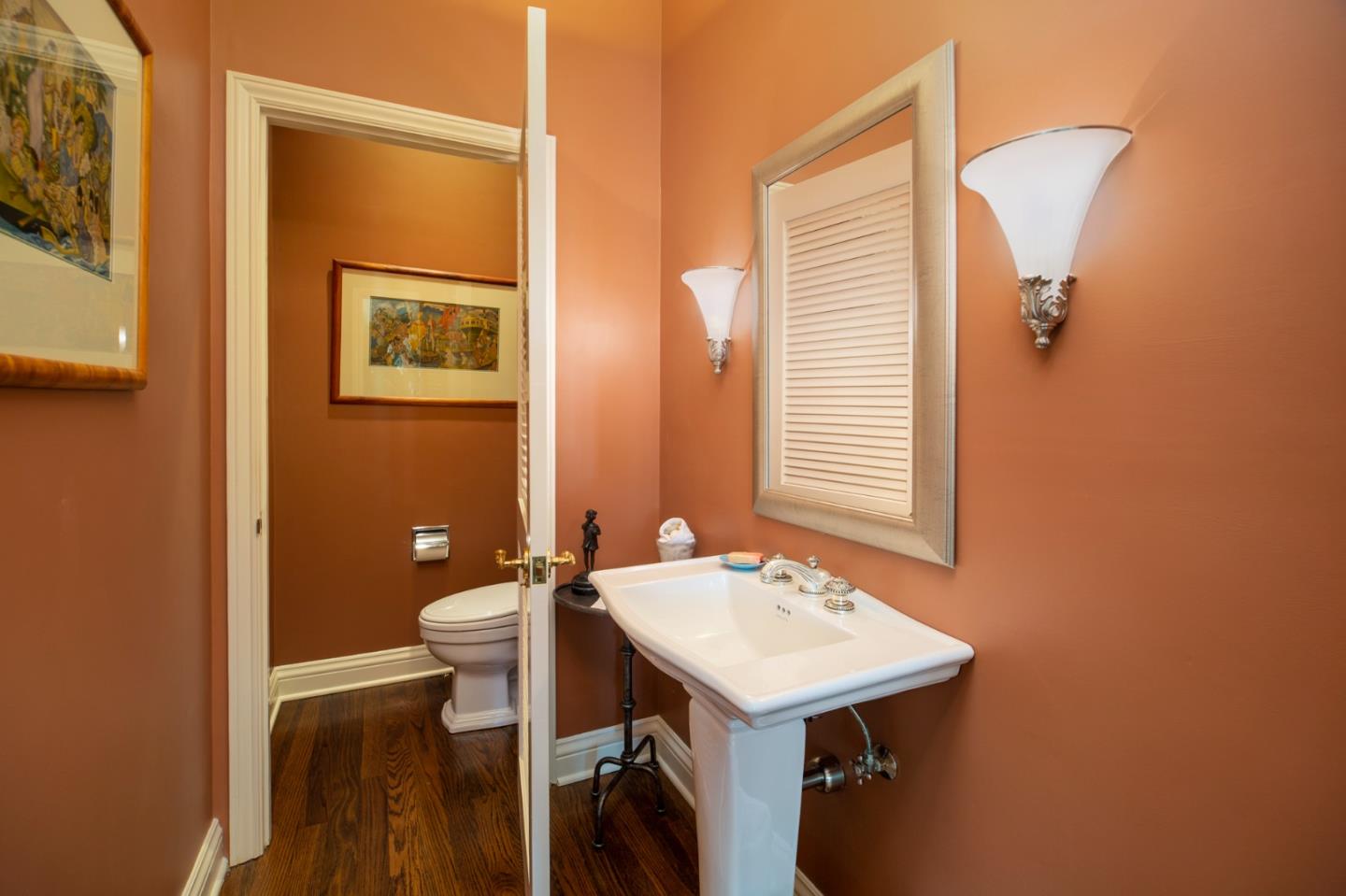 1534 Riata Road Pebble Beach, CA 93953 - Photo 33 of 50 a bathroom with a sink a mirror and a toilet