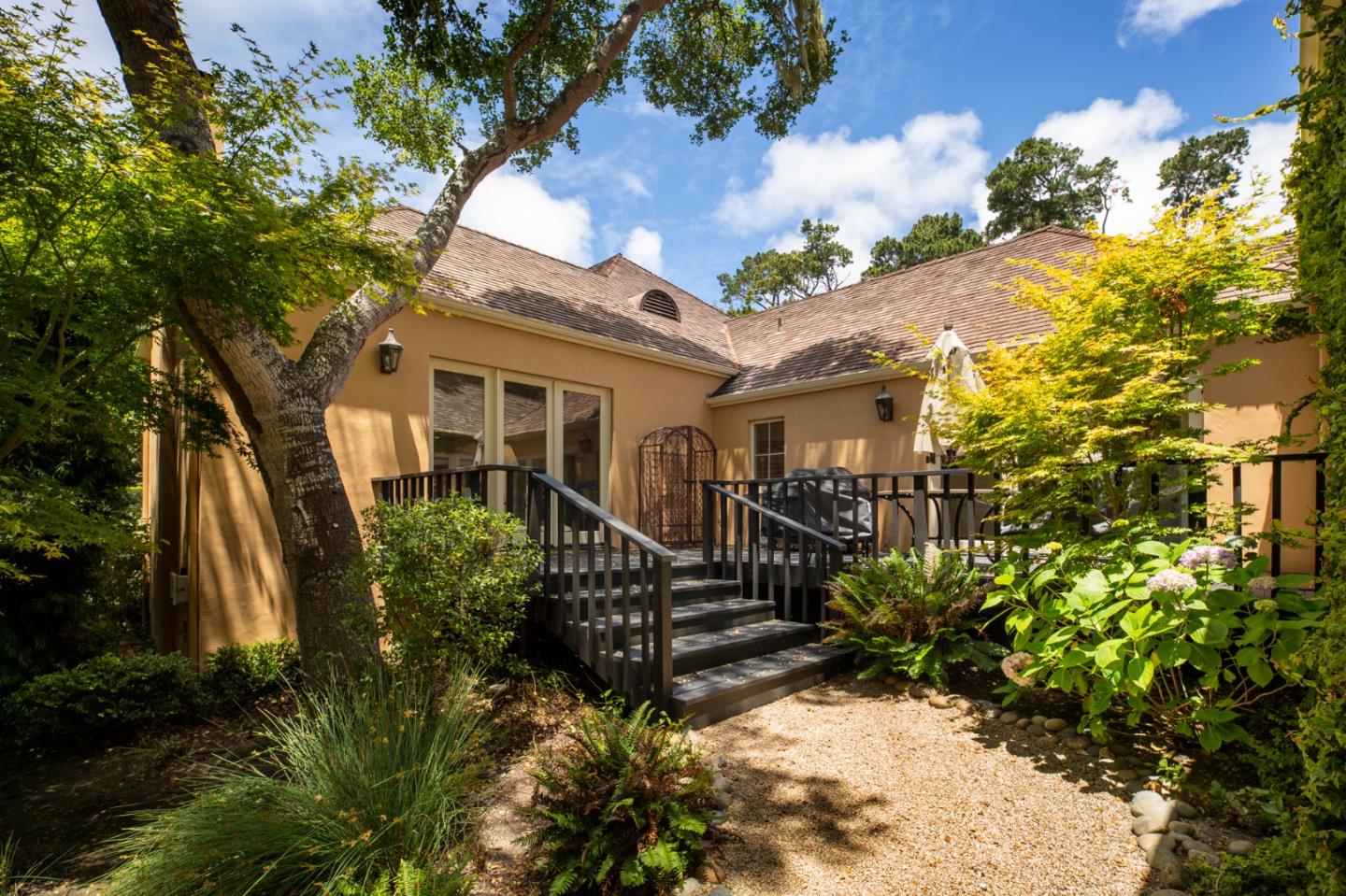 1534 Riata Road Pebble Beach, CA 93953 - Photo 37 of 50 a view of a house with wooden fence