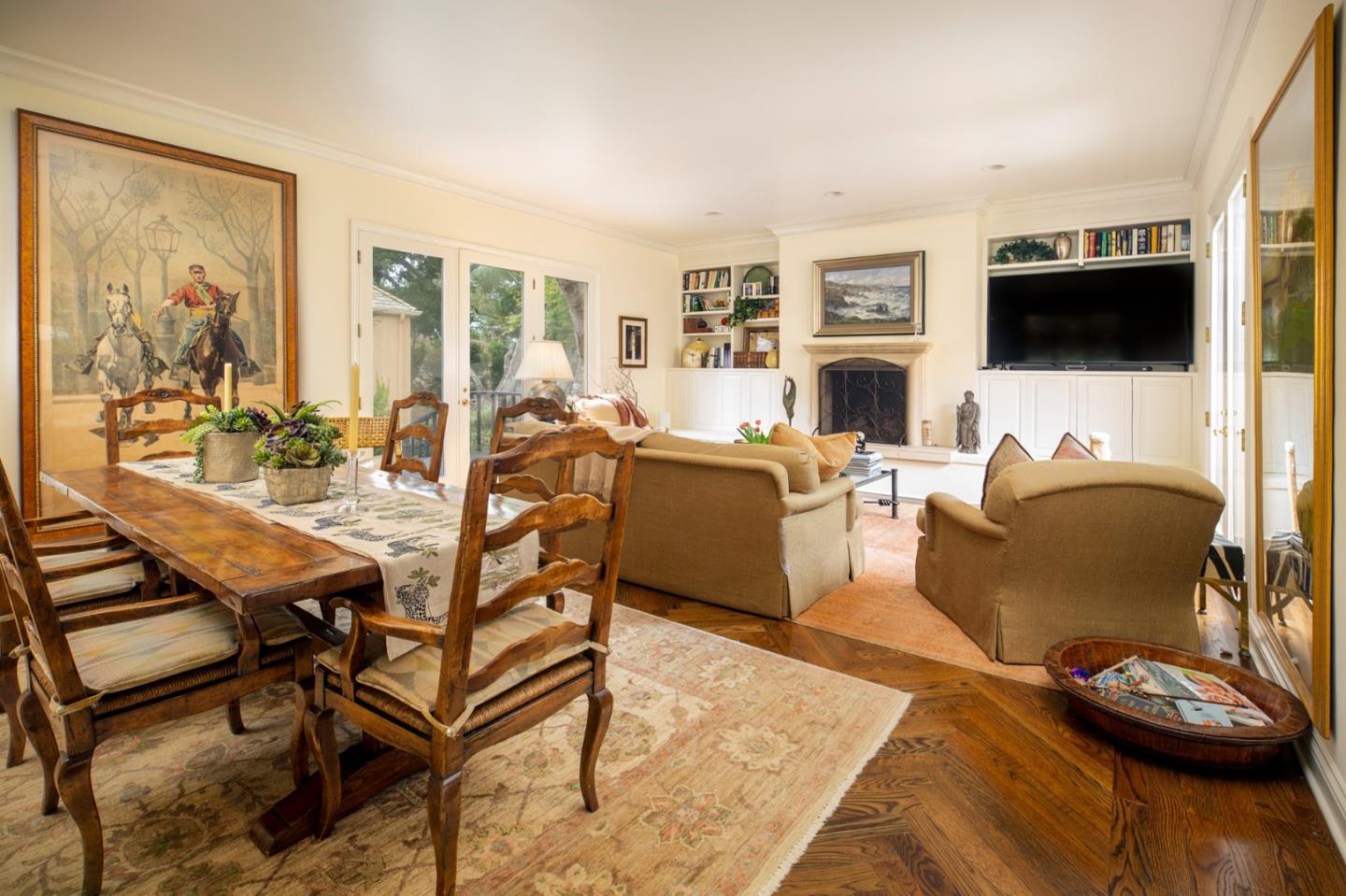 1534 Riata Road Pebble Beach, CA 93953 - Photo 4 of 50 a living room with furniture a flat screen tv and a fireplace