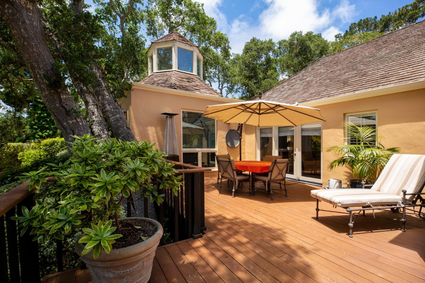 1534 Riata Road Pebble Beach, CA 93953 - Photo 45 of 50 a view of a patio with couches table and chairs and potted plants