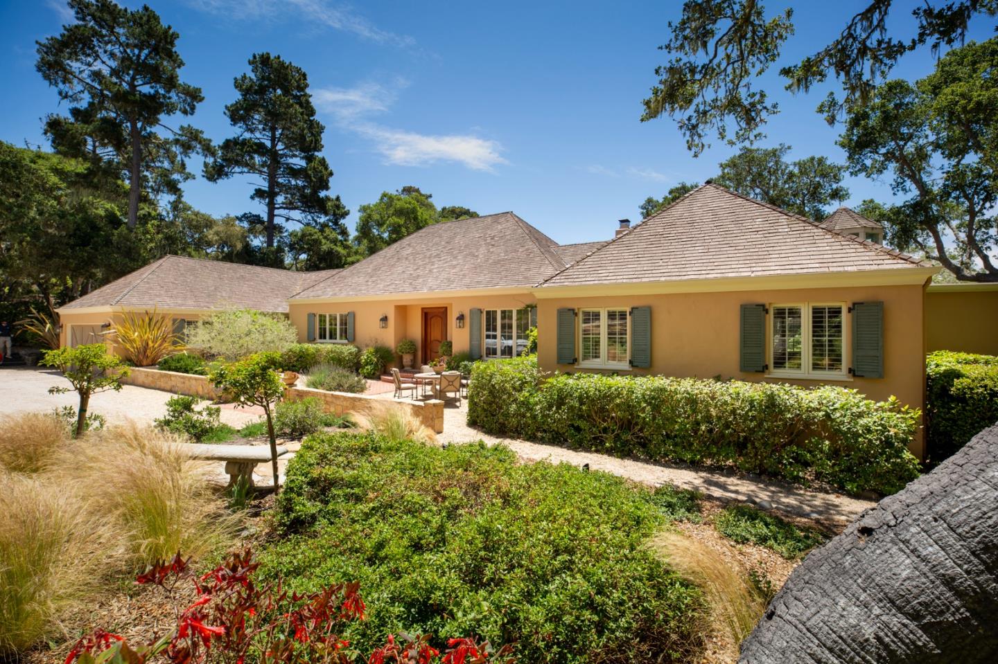 1534 Riata Road Pebble Beach, CA 93953 - Photo 47 of 50 a view of a house with swimming pool and garden