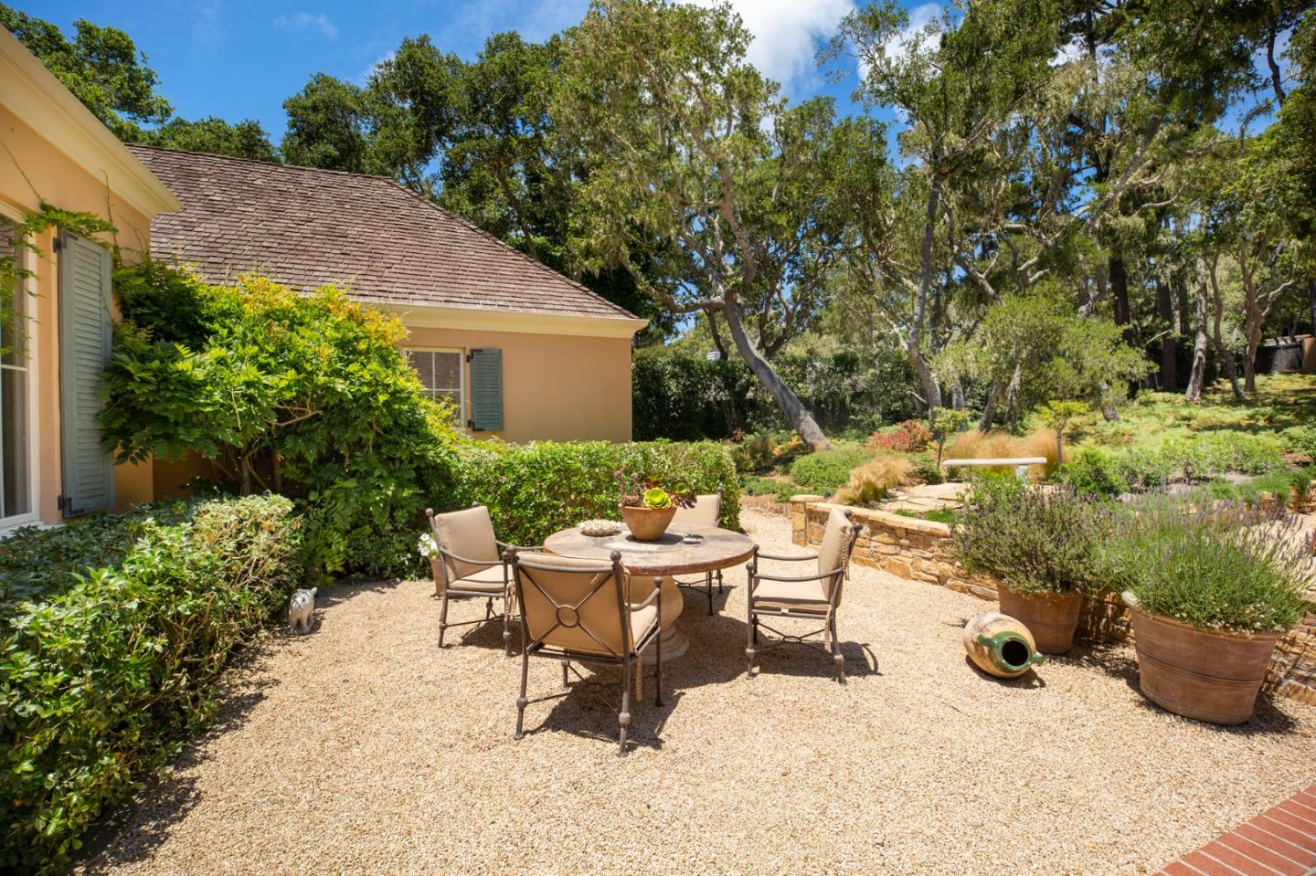 1534 Riata Road Pebble Beach, CA 93953 - Photo 48 of 50 a view of backyard with outdoor seating and plants