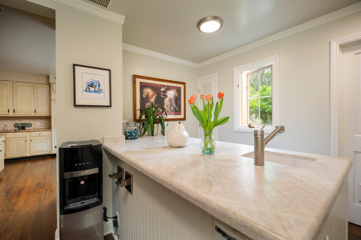 1534 Riata Road Pebble Beach, CA 93953 - Photo 9 of 50 a view of a kitchen with a table and chairs