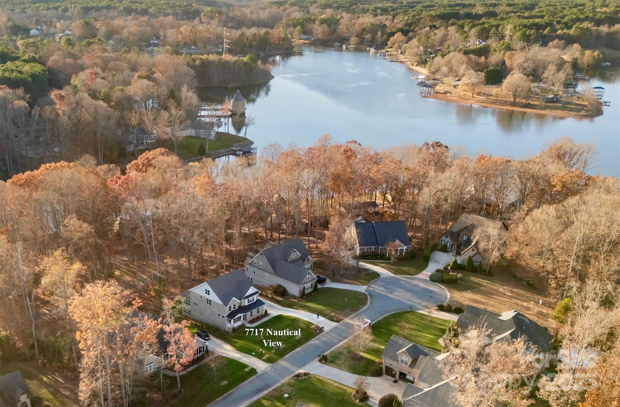 an aerial view of a house with a lake view