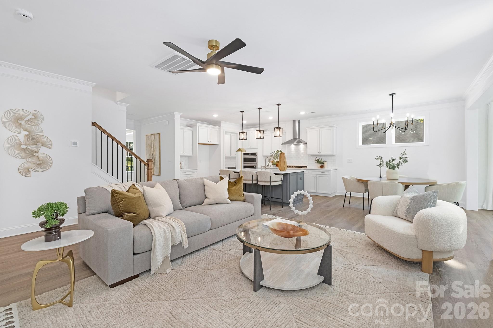 7717 Nautical View Denver, NC 28037 - Photo 11 of 43 a living room with furniture and a view of kitchen