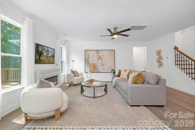 a living room with furniture and a large window
