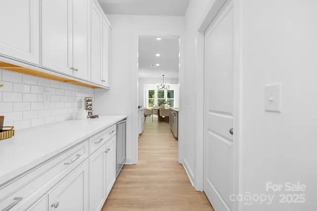 a kitchen with white cabinets