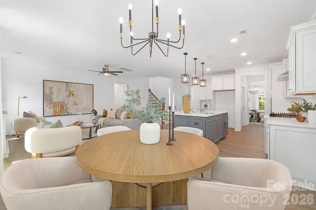 a view of a backyard with table and chairs