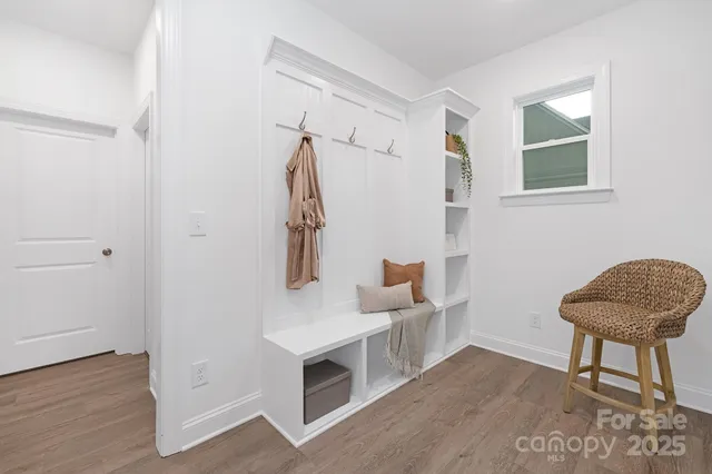 a living room with furniture and a chair