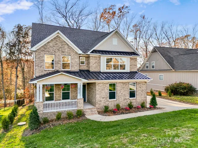 front view of a house with a yard