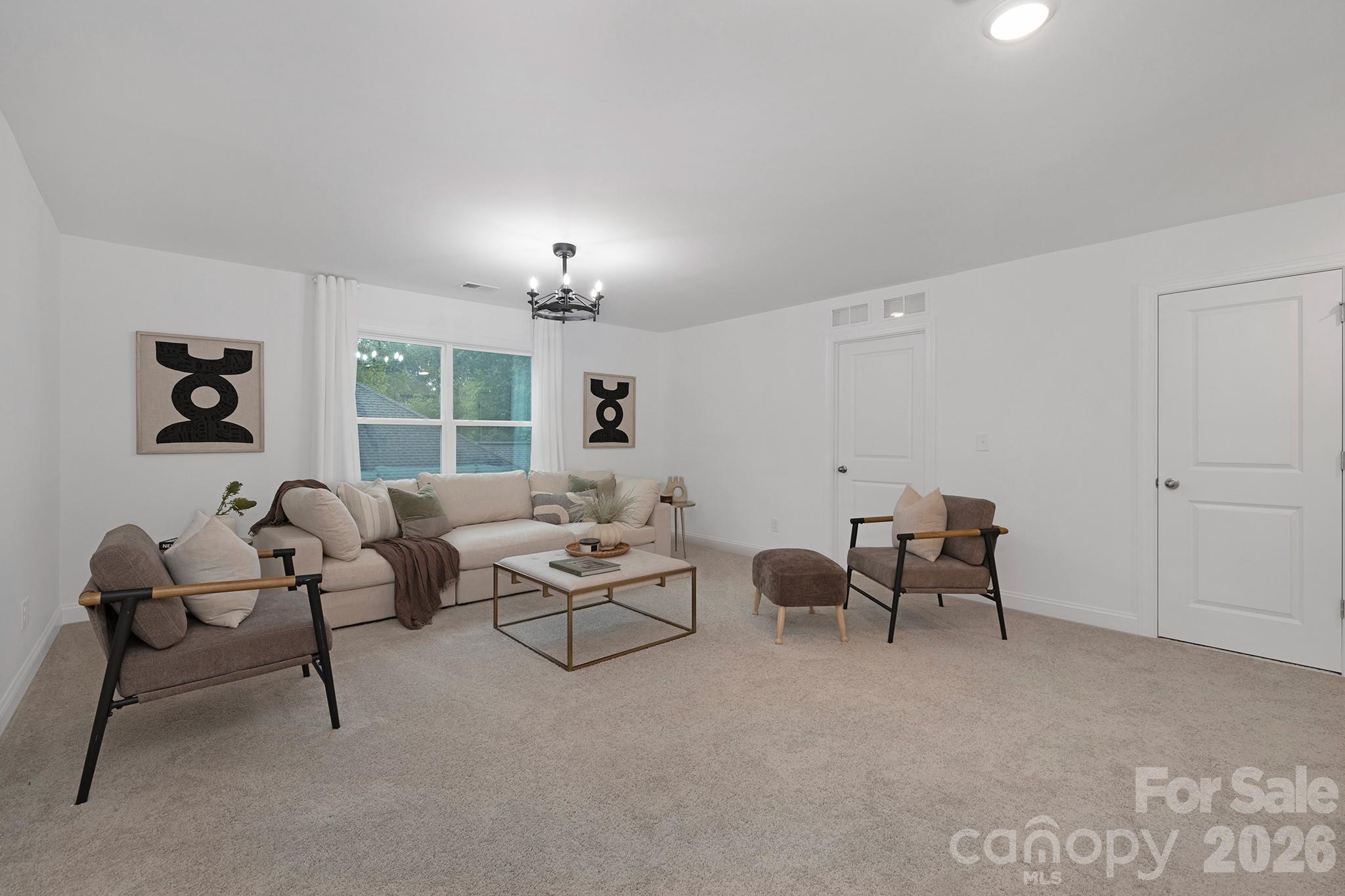 7717 Nautical View Denver, NC 28037 - Photo 26 of 43 a living room with furniture and a window