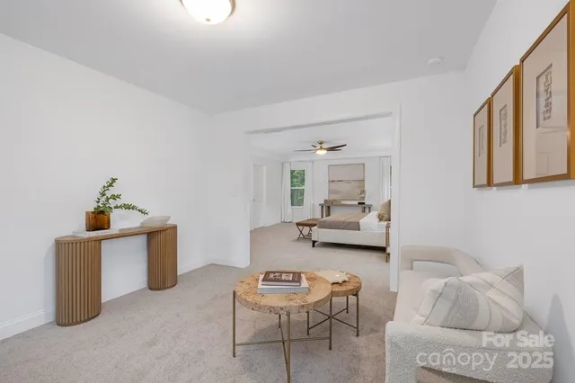 a living room with furniture and a table