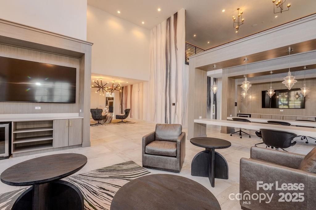 3110 Doe River Way, Unit RHODES Matthews, NC 28105 - Photo 21 of 48 a living room with furniture and a flat screen tv