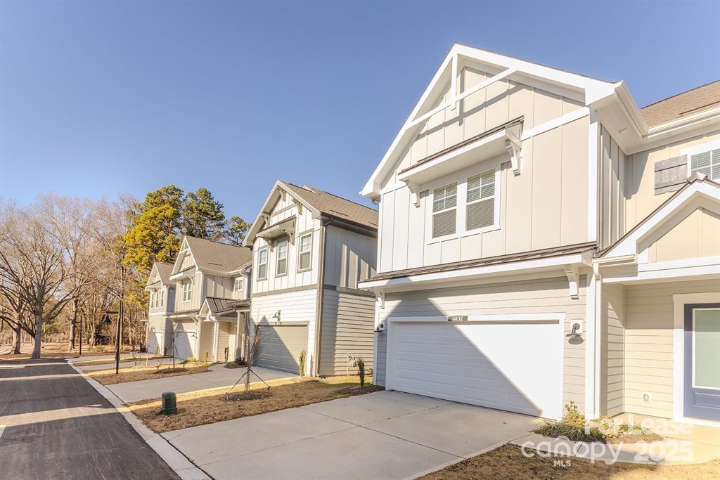 3110 Doe River Way, Unit RHODES Matthews, NC 28105 - Photo 48 of 48 a view of a white apartments with large windows