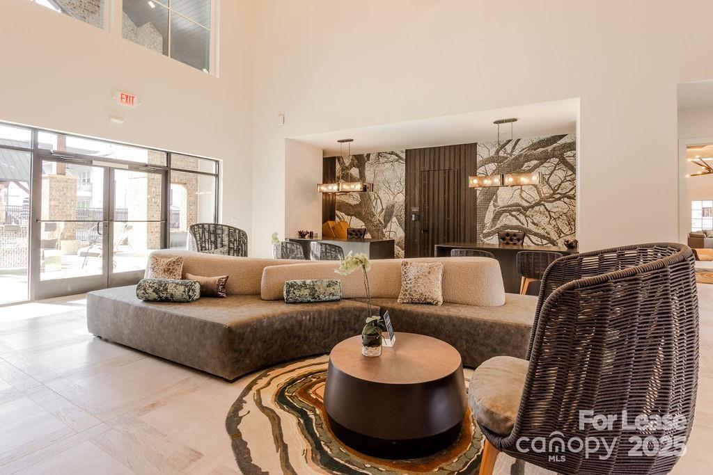 3110 Doe River Way, Unit RHODES Matthews, NC 28105 - Photo 7 of 48 a living room with furniture and a large window
