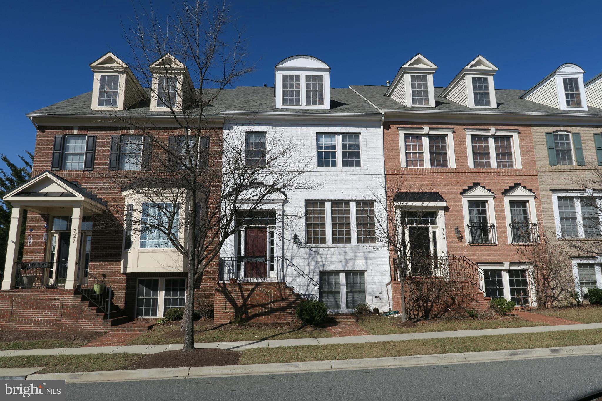 725 Ridgemont Avenue Rockville, MD 20850 - Photo 1 of 17 a front view of a multi story residential apartment building