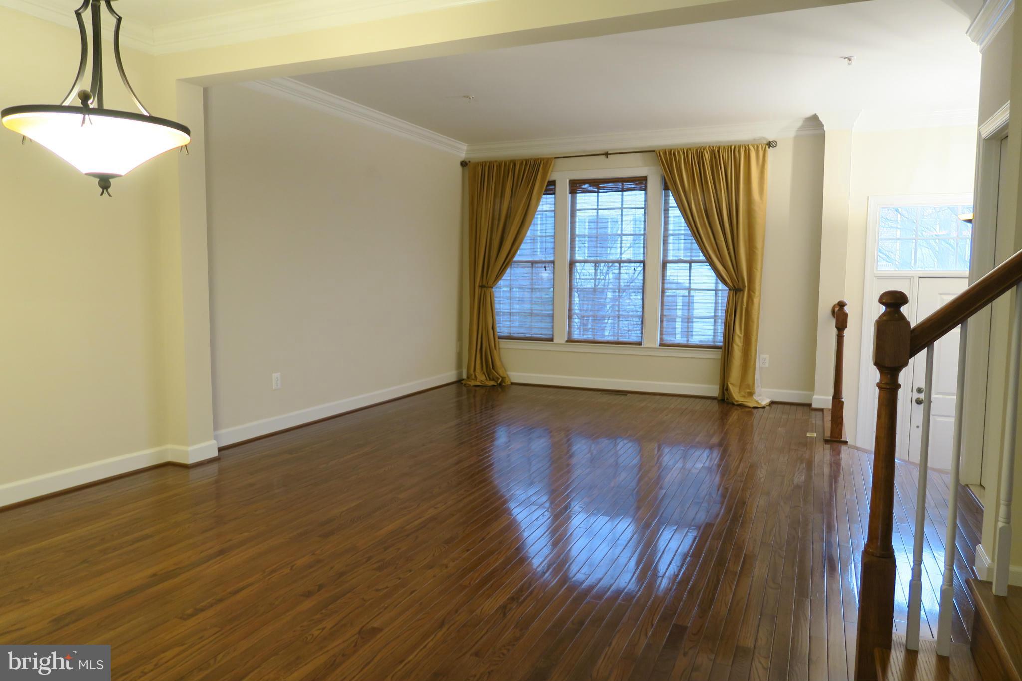 725 Ridgemont Avenue Rockville, MD 20850 - Photo 12 of 17 a view of a room with wooden floor and windows