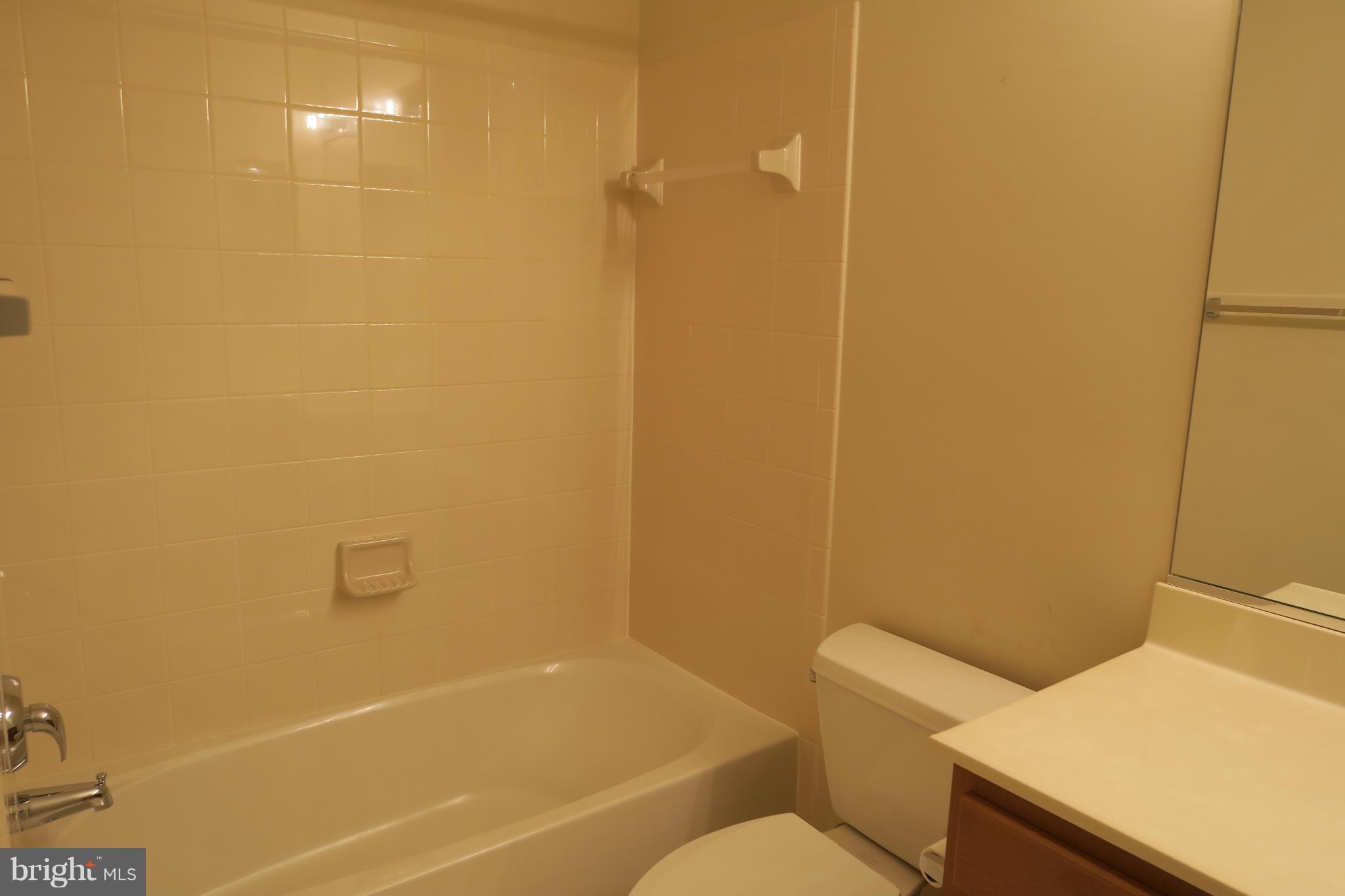 725 Ridgemont Avenue Rockville, MD 20850 - Photo 15 of 17 a bathroom with a sink and a toilet