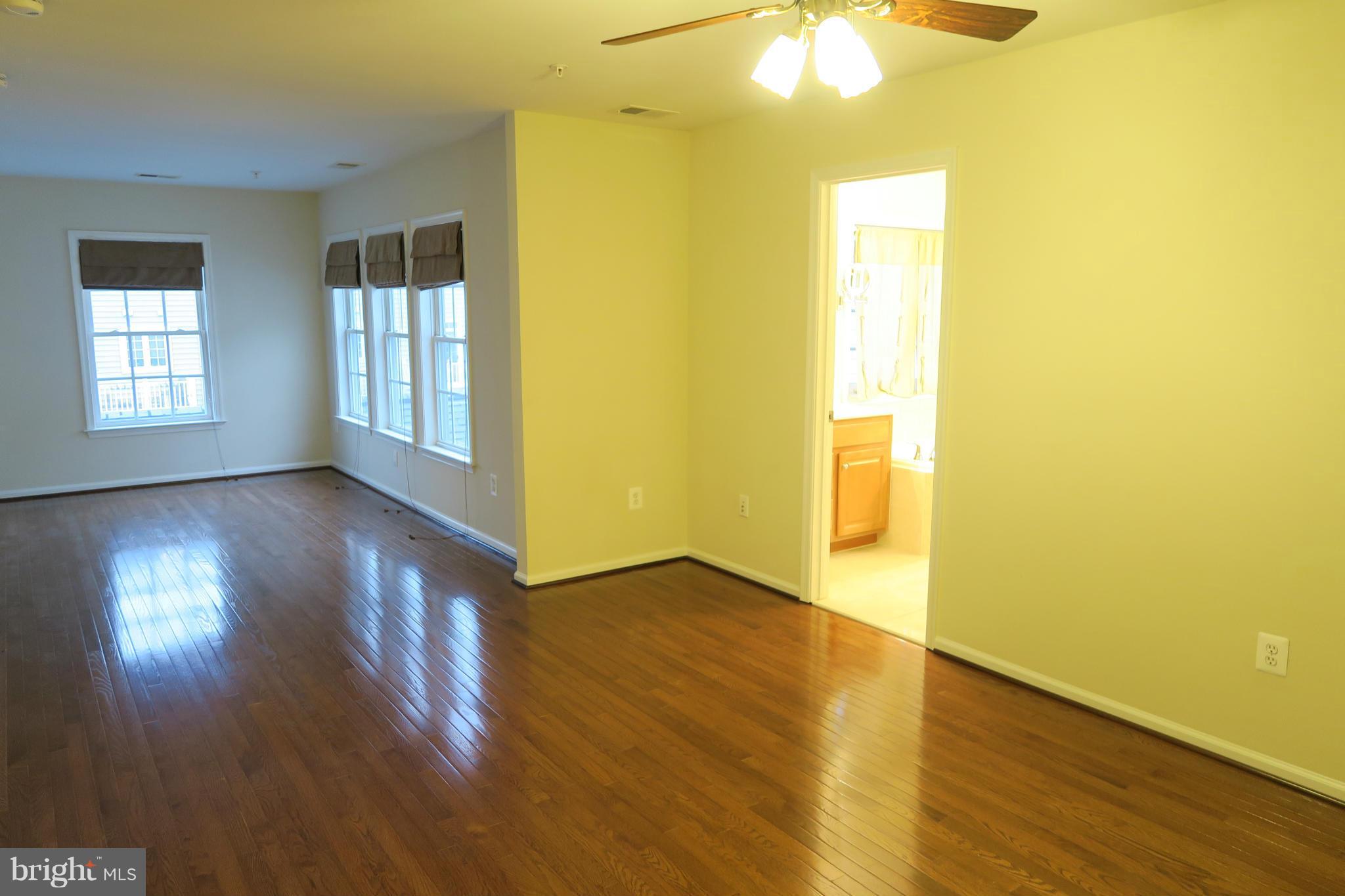 725 Ridgemont Avenue Rockville, MD 20850 - Photo 5 of 17 a view of empty room with wooden floor and fan