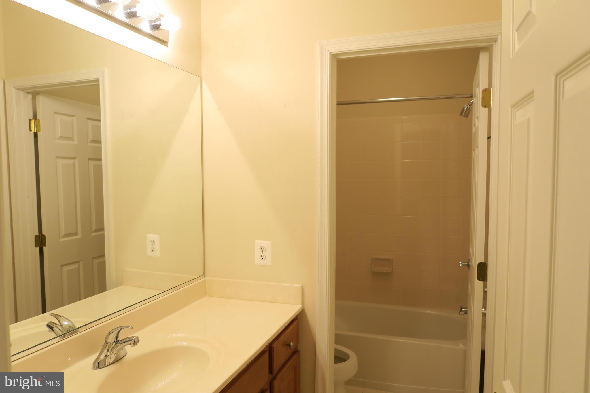 725 Ridgemont Avenue Rockville, MD 20850 - Photo 10 of 17 a bathroom with a tub and shower