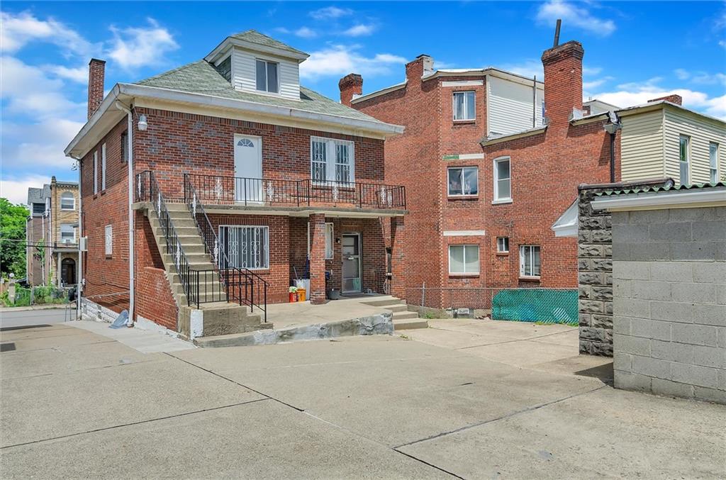 3430 Dawson Street Pittsburgh, PA 15213 - Photo 3 of 20 a front view of a house with a yard
