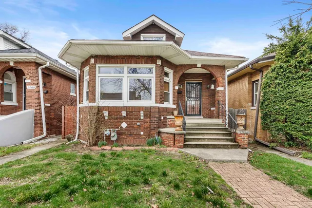 front view of a house with a small yard