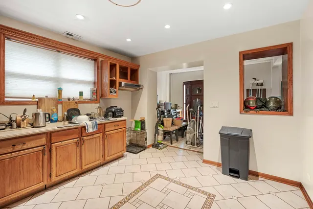 a kitchen with a sink and a refrigerator