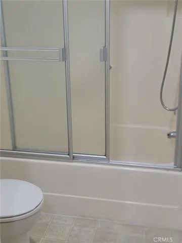 a kitchen with stainless steel appliances a sink stove and cabinets