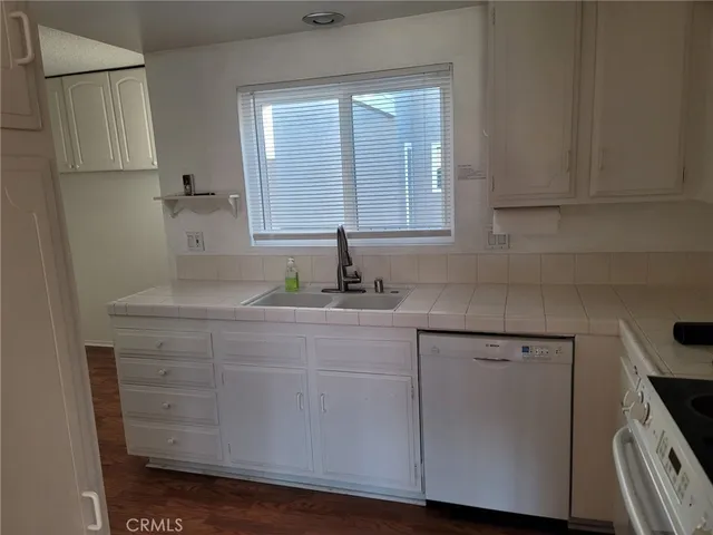 a view of storage and utility room with window