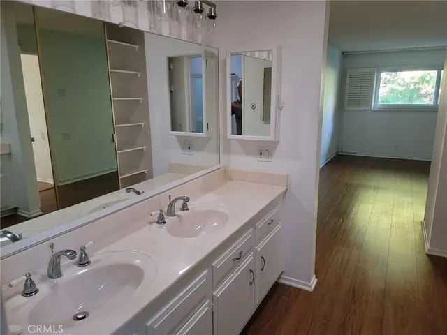 a bathroom with a glass shower door