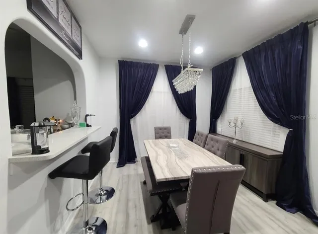 a very nice looking dining room with a table and chairs