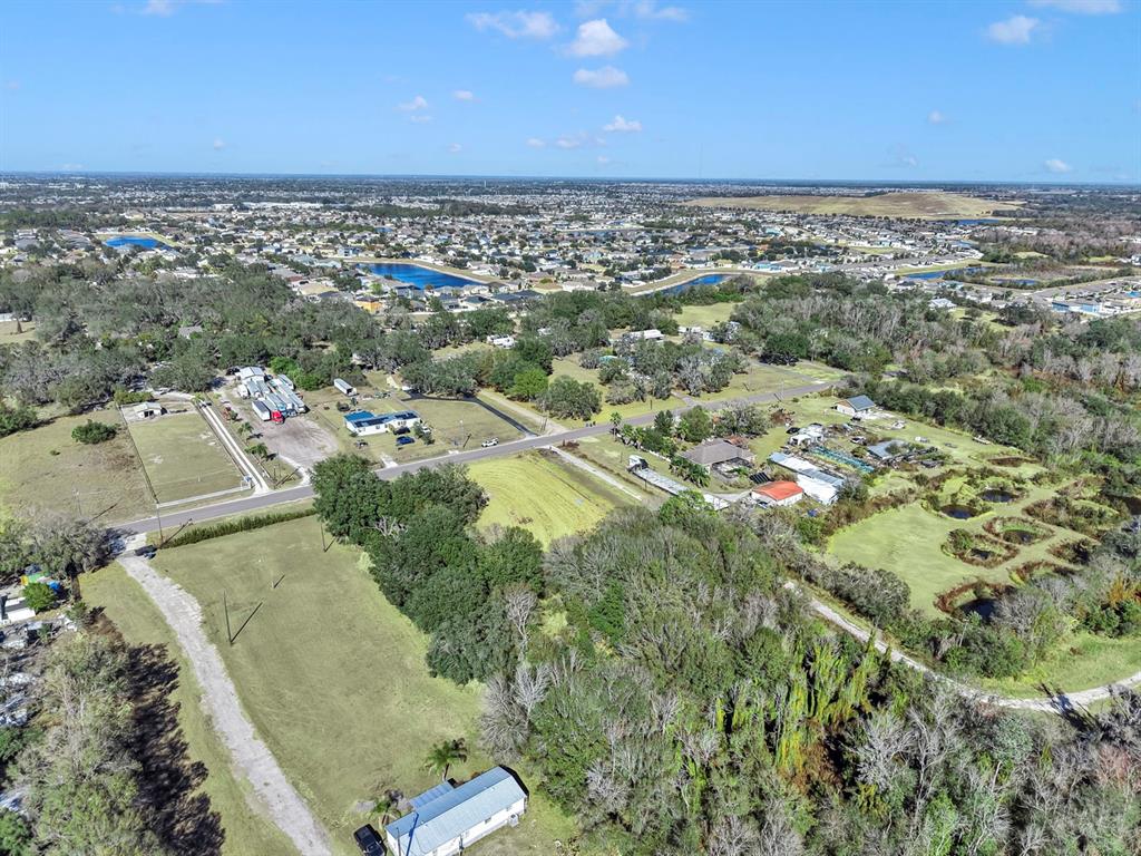 10611 Sumner Road Wimauma, FL 33598 - Photo 15 of 30 an aerial view of residential houses with outdoor space