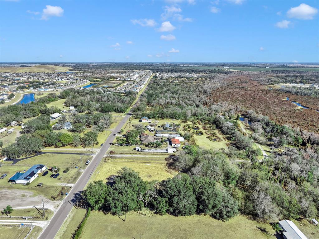 10611 Sumner Road Wimauma, FL 33598 - Photo 17 of 30 an aerial view of residential houses with outdoor space
